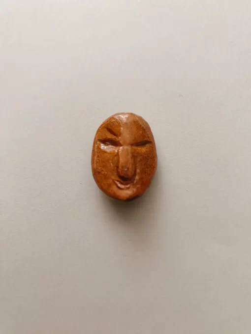 Angry face necklace