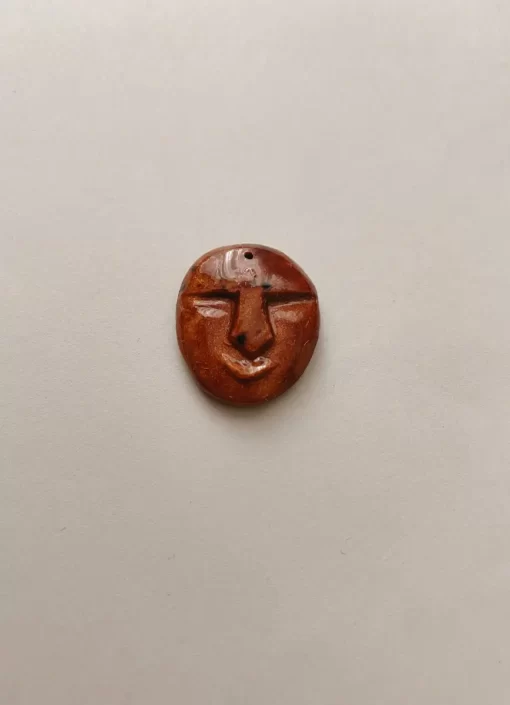 Angry face Carved avocado pit necklace